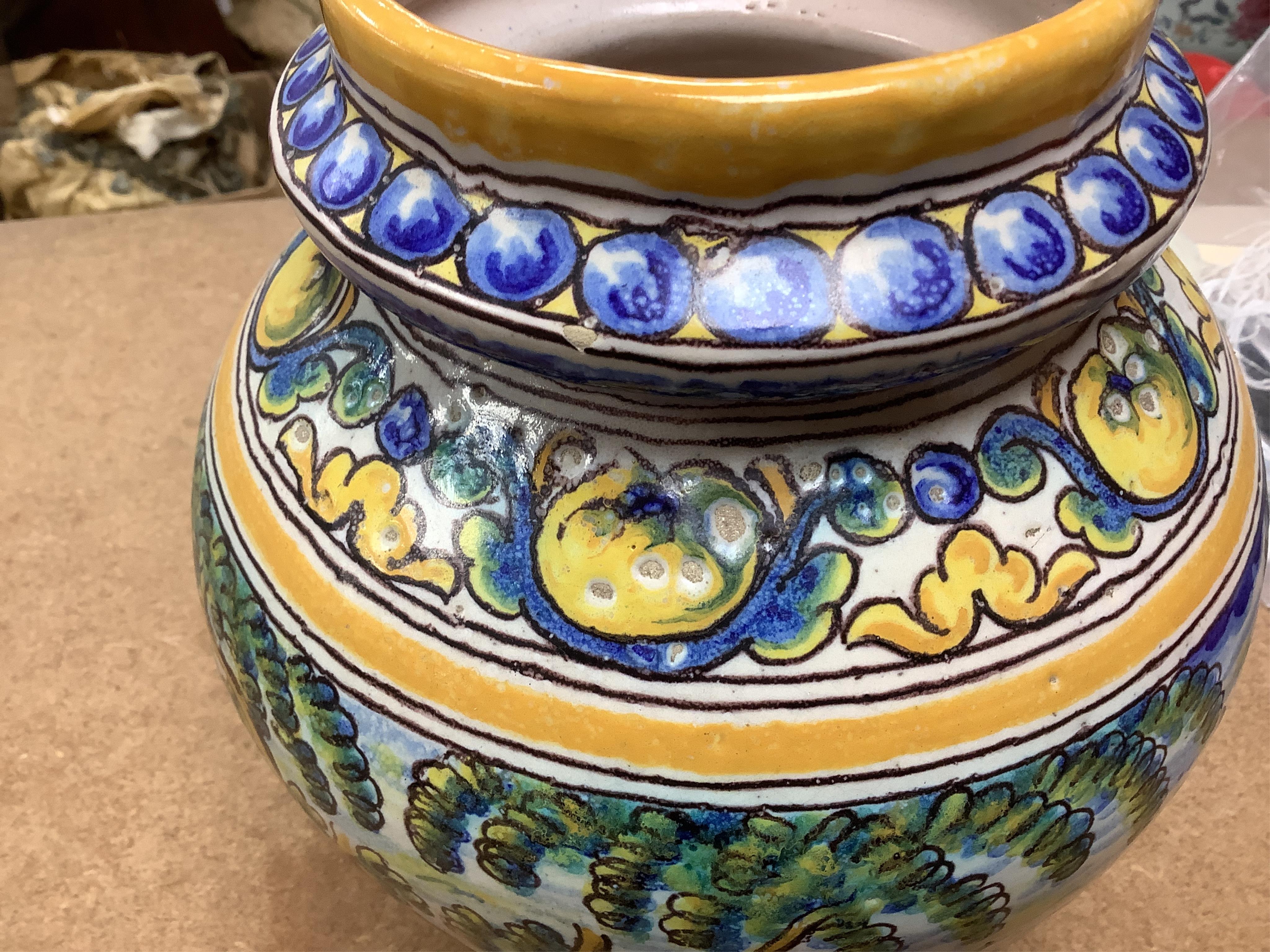 An Italian maiolica teapot and jug and a Talavera maiolica vase, 25cm high (3). Condition - jar good, teapot restored and cracked